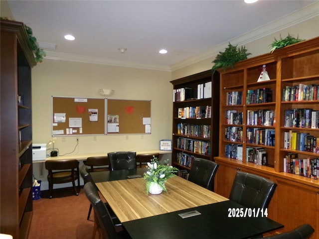 carpeted dining space featuring ornamental molding