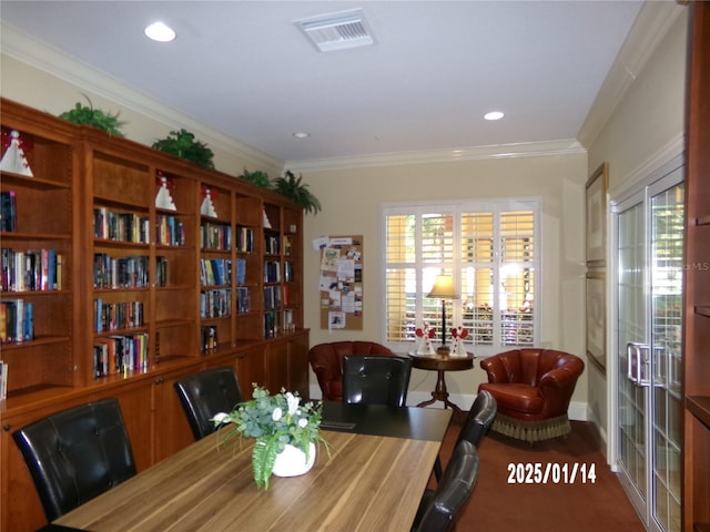 dining space with ornamental molding