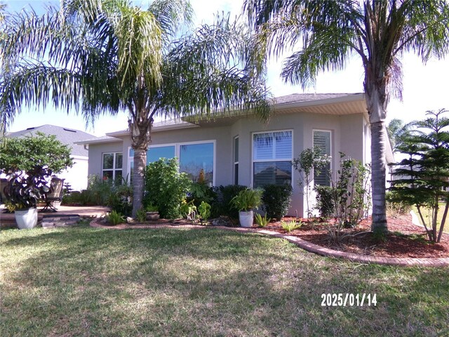 10173 Julia Isles Ave, Oxford, FL 34484 - single story home with a front yard and stucco siding