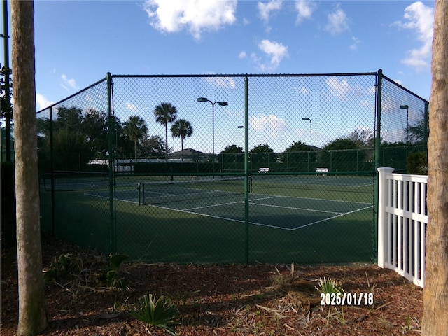 10173 Julia Isles Ave, Oxford, FL 34484 - view of tennis court featuring fence