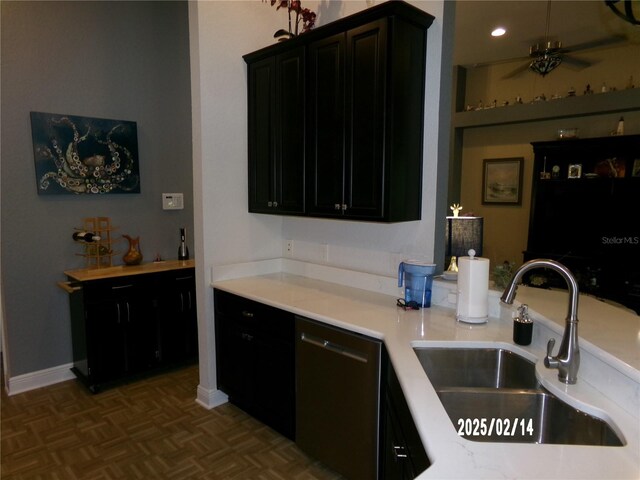 10173 Julia Isles Ave, Oxford, FL 34484 - kitchen with a sink, dishwasher, dark cabinets, and light countertops