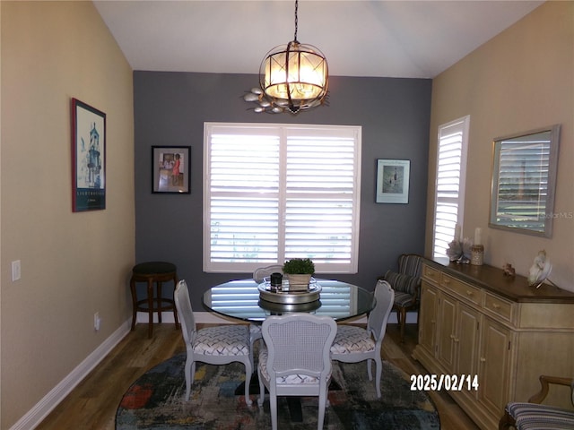 10173 Julia Isles Ave, Oxford, FL 34484 - dining space with an inviting chandelier, wood finished floors, and baseboards