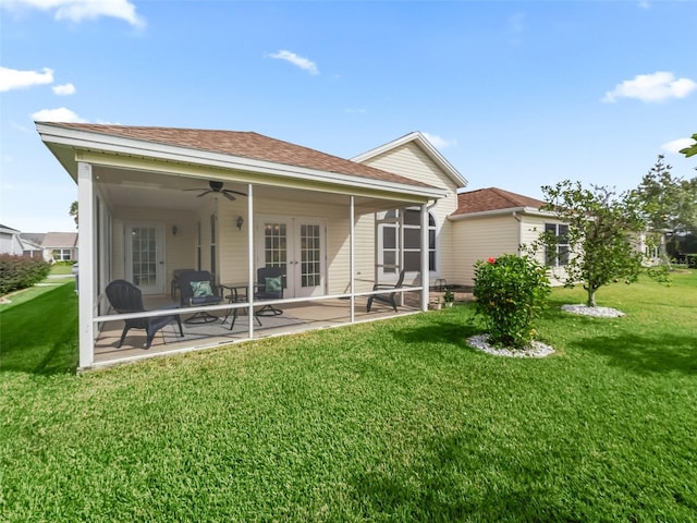 rear view of house with a patio area, french doors, ceiling fan, and a lawn