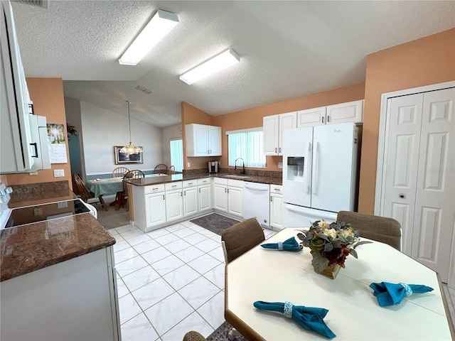 kitchen featuring sink, decorative light fixtures, kitchen peninsula, white appliances, and white cabinets