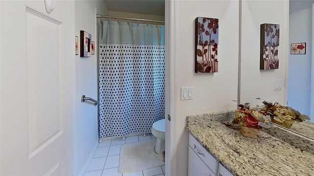 bathroom featuring vanity, curtained shower, tile patterned floors, and toilet