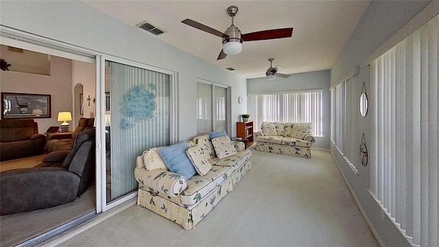 sunroom featuring ceiling fan