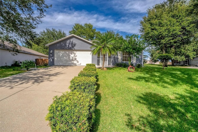 view of front of house featuring a garage and a front lawn