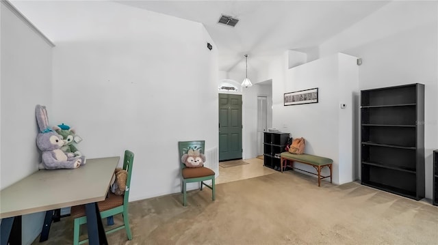 sitting room with lofted ceiling and carpet flooring