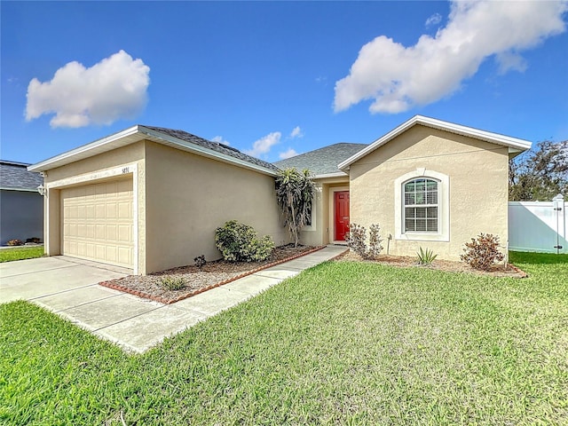 single story home featuring a front lawn and a garage