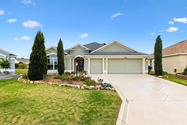 ranch-style house with a garage, driveway, a front lawn, and stucco siding