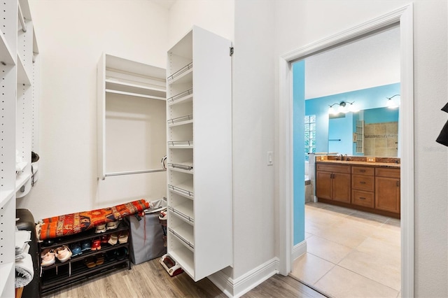 spacious closet with light wood finished floors