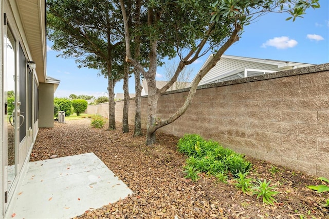 view of yard with a patio area and a fenced backyard