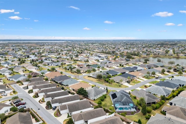 aerial view featuring a water view and a residential view