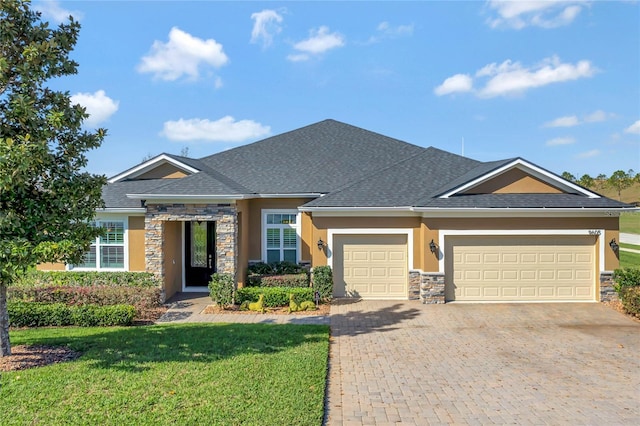 view of front facade with a garage and a front yard