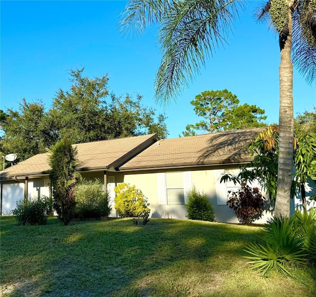 ranch-style house with a front lawn