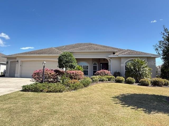 ranch-style home featuring an attached garage, stucco siding, concrete driveway, and a front yard