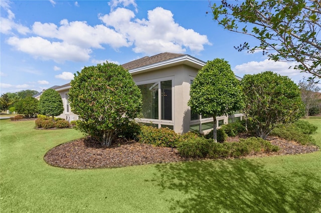 2935 Cedar Grove Loop, The Villages, FL 32163 - view of side of property featuring stucco siding and a yard