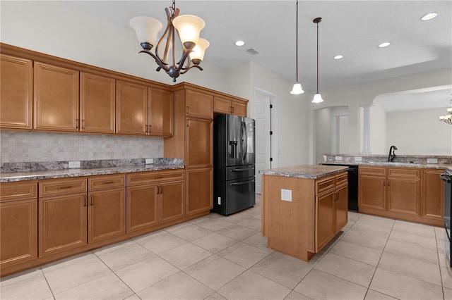 2935 Cedar Grove Loop, The Villages, FL 32163 - kitchen with refrigerator with ice dispenser, a chandelier, brown cabinets, dishwasher, and a center island