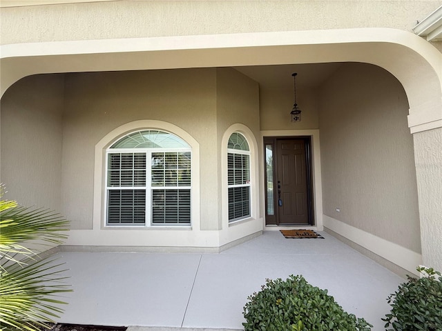 2935 Cedar Grove Loop, The Villages, FL 32163 - doorway to property featuring stucco siding