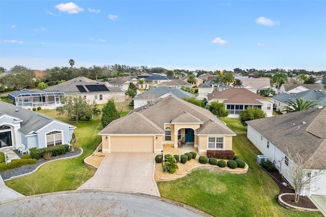 view of front of house featuring a residential view, stucco siding, driveway, and an attached garage