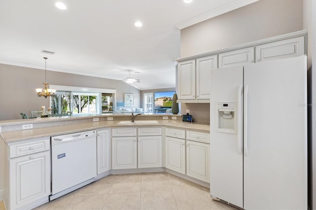 kitchen with ornamental molding, white cabinetry, a sink, and white appliances