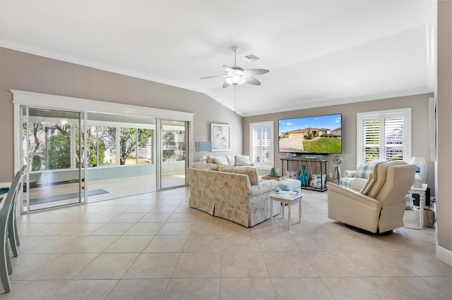 living room with crown molding, visible vents, lofted ceiling, and a healthy amount of sunlight