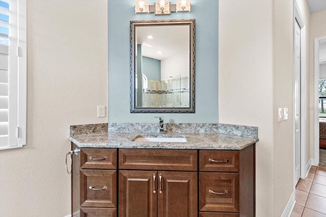 bathroom with vanity and tile patterned flooring