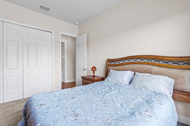 bedroom with a closet and carpet flooring