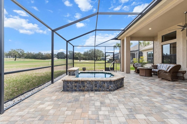 view of patio featuring an in ground hot tub, a lanai, and outdoor lounge area