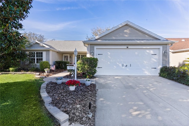 ranch-style home with concrete driveway, a front lawn, and an attached garage