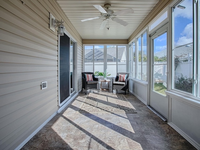 sunroom / solarium with ceiling fan