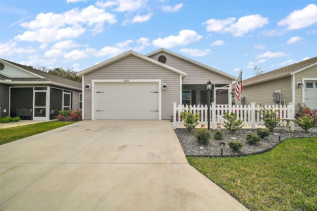 view of front of property featuring a front yard and a garage