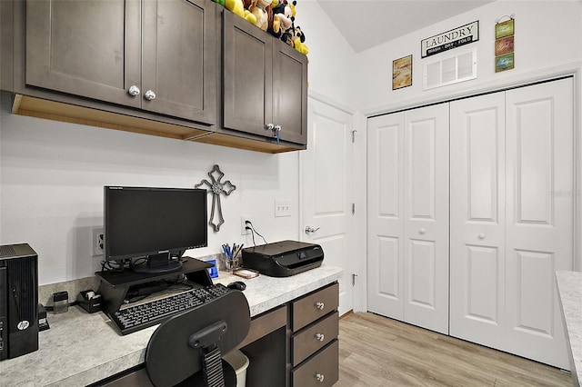 office with light hardwood / wood-style floors