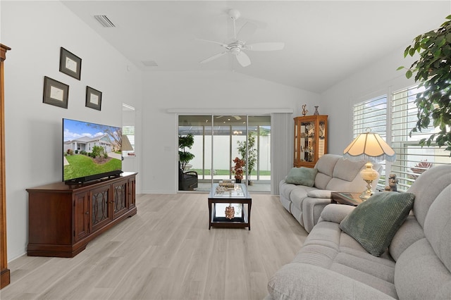 living area featuring plenty of natural light, light wood-style flooring, visible vents, and ceiling fan