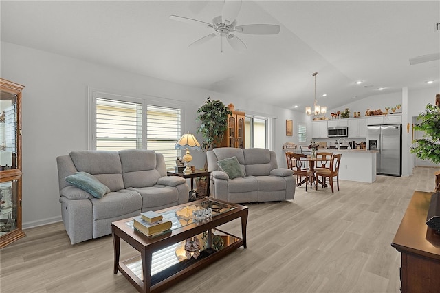 living room featuring vaulted ceiling, ceiling fan, light wood finished floors, and baseboards