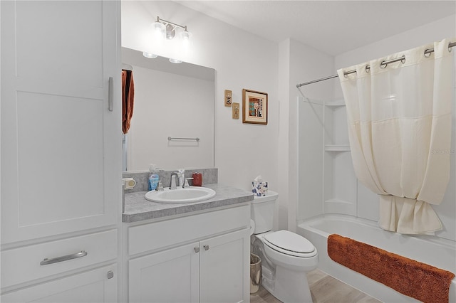 full bathroom with toilet, shower / tub combo with curtain, and vanity