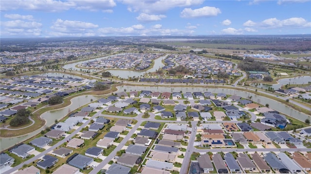 bird's eye view with a water view and a residential view