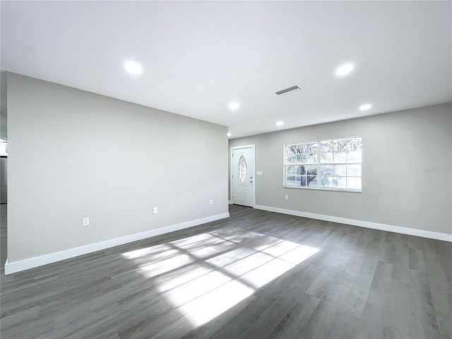 empty room with dark hardwood / wood-style floors