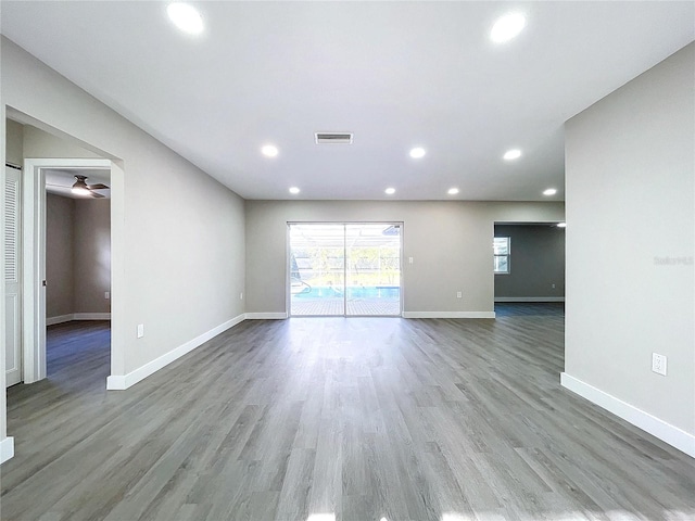 unfurnished living room featuring wood-type flooring