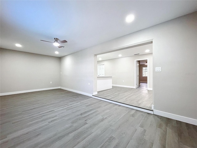 spare room with ceiling fan and light hardwood / wood-style floors