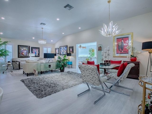 dining area with a notable chandelier, lofted ceiling, recessed lighting, visible vents, and light wood-style flooring