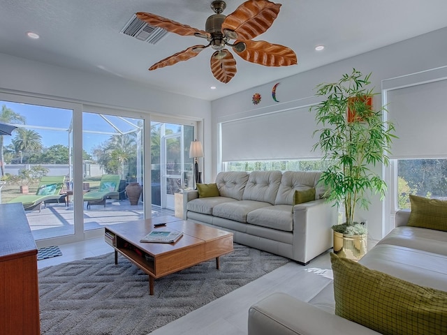 sunroom with visible vents and ceiling fan