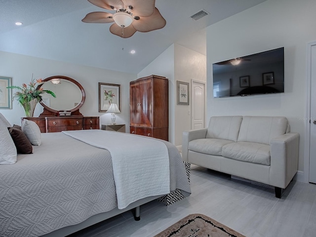 bedroom with light wood finished floors, lofted ceiling, recessed lighting, visible vents, and ceiling fan