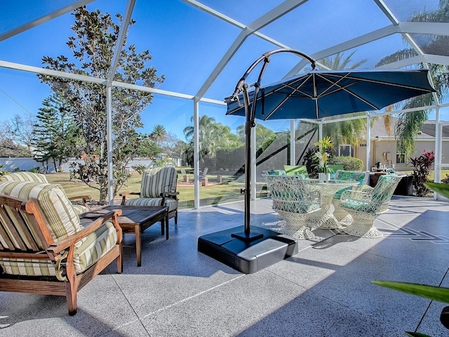 view of patio / terrace featuring a lanai