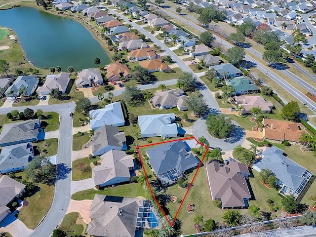 birds eye view of property featuring a water view and a residential view