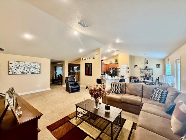 living room with light carpet and lofted ceiling