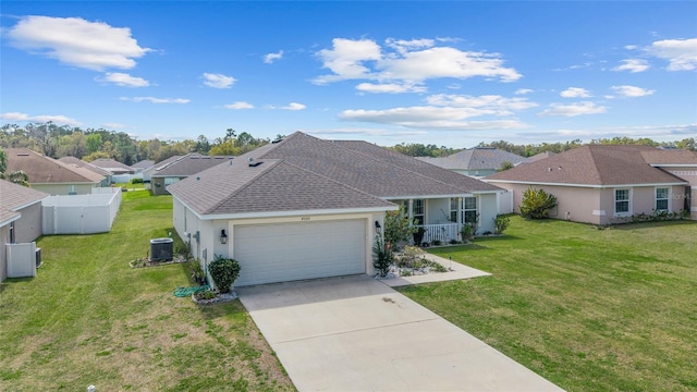 4000 SE 98th Pl, Belleview, FL 34420 - ranch-style house featuring a front lawn, central air condition unit, concrete driveway, stucco siding, and a garage