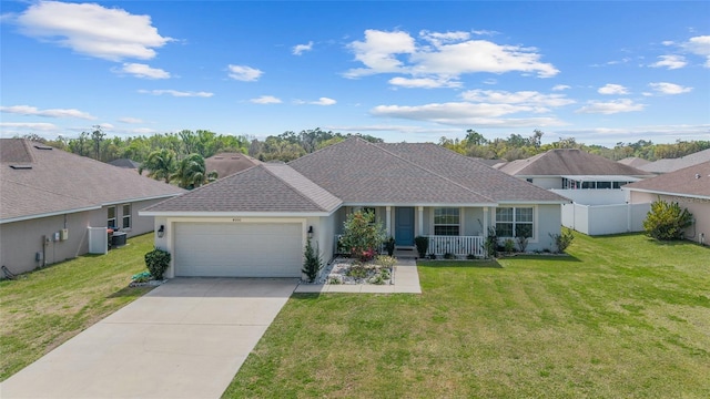 4000 SE 98th Pl, Belleview, FL 34420 - ranch-style house with stucco siding, a front lawn, fence, concrete driveway, and a garage