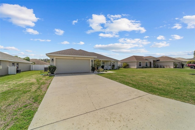4000 SE 98th Pl, Belleview, FL 34420 - single story home featuring a front lawn, fence, a residential view, a garage, and driveway