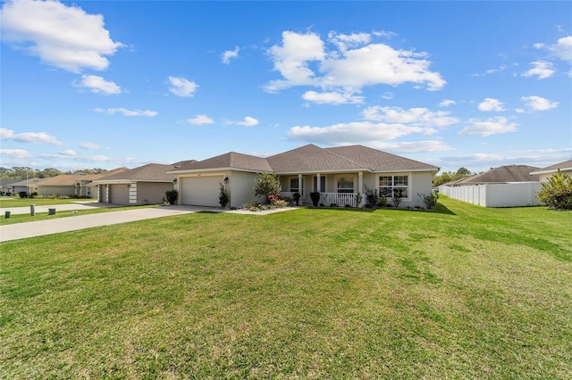 4000 SE 98th Pl, Belleview, FL 34420 - ranch-style house featuring driveway, a porch, fence, a front yard, and a garage